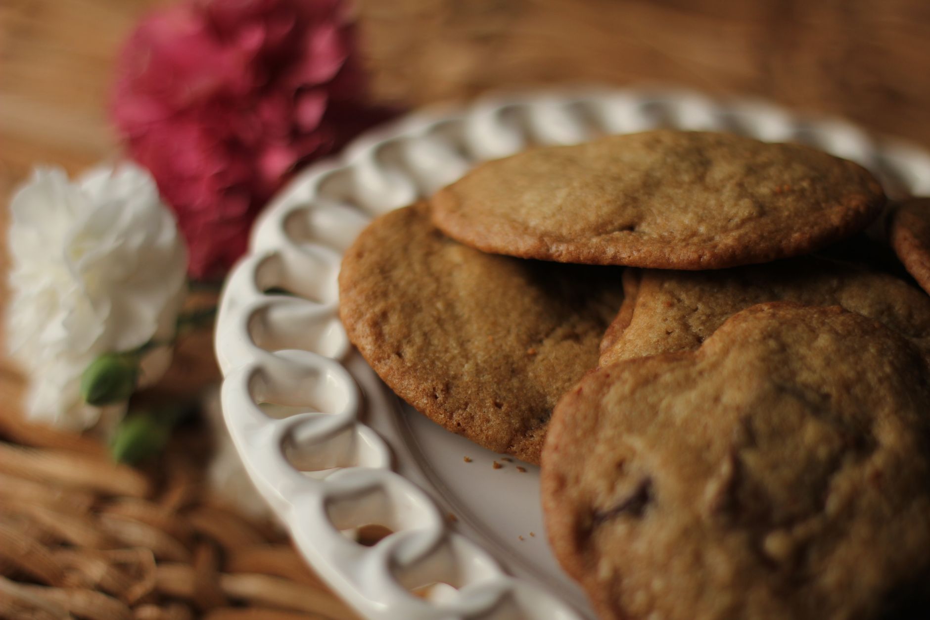 Drizzling praline sauce on cookies