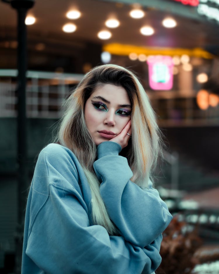 Young Woman Leaning Head On Hand