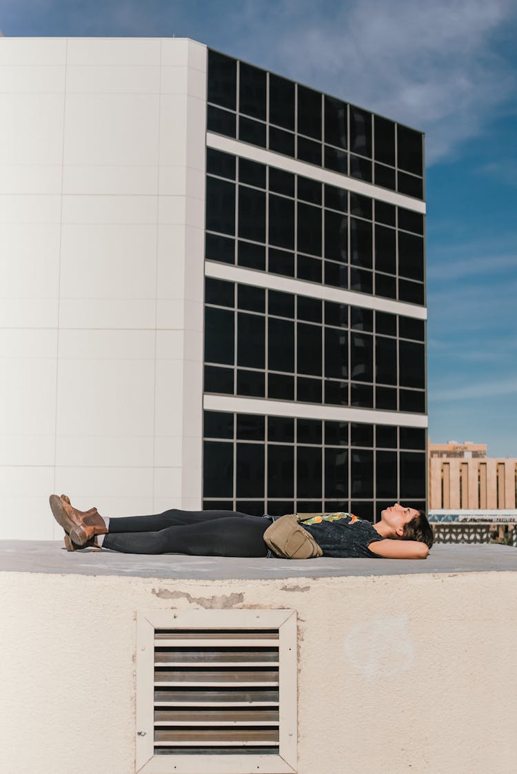 Woman Lying On A Rooftop 