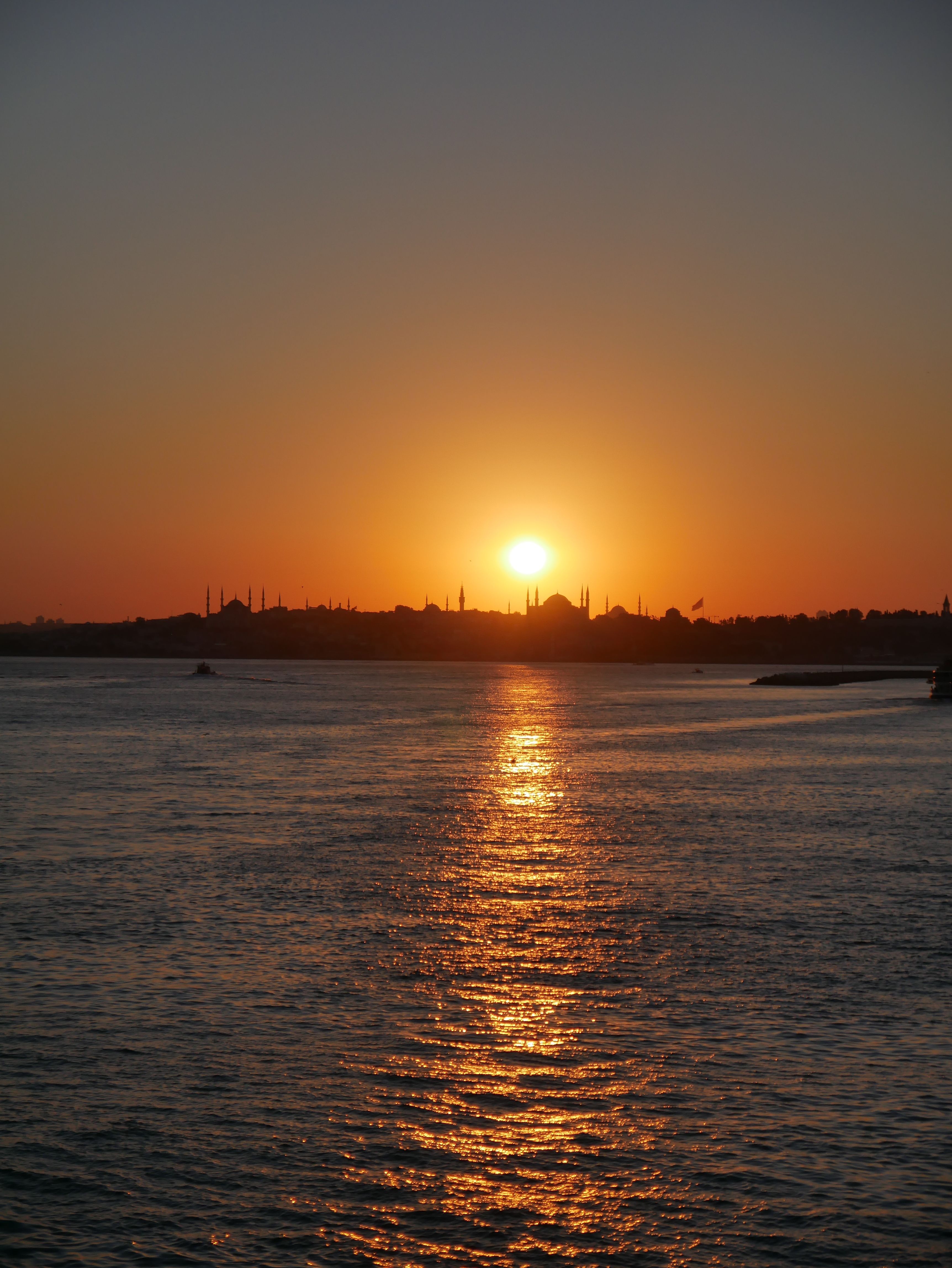 Silhouetted City Skyline at Sunset · Free Stock Photo