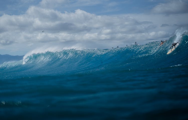 People Surfing In The Ocean