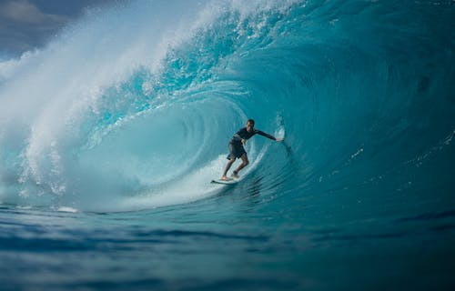 Man on Board Surfing in Ocean