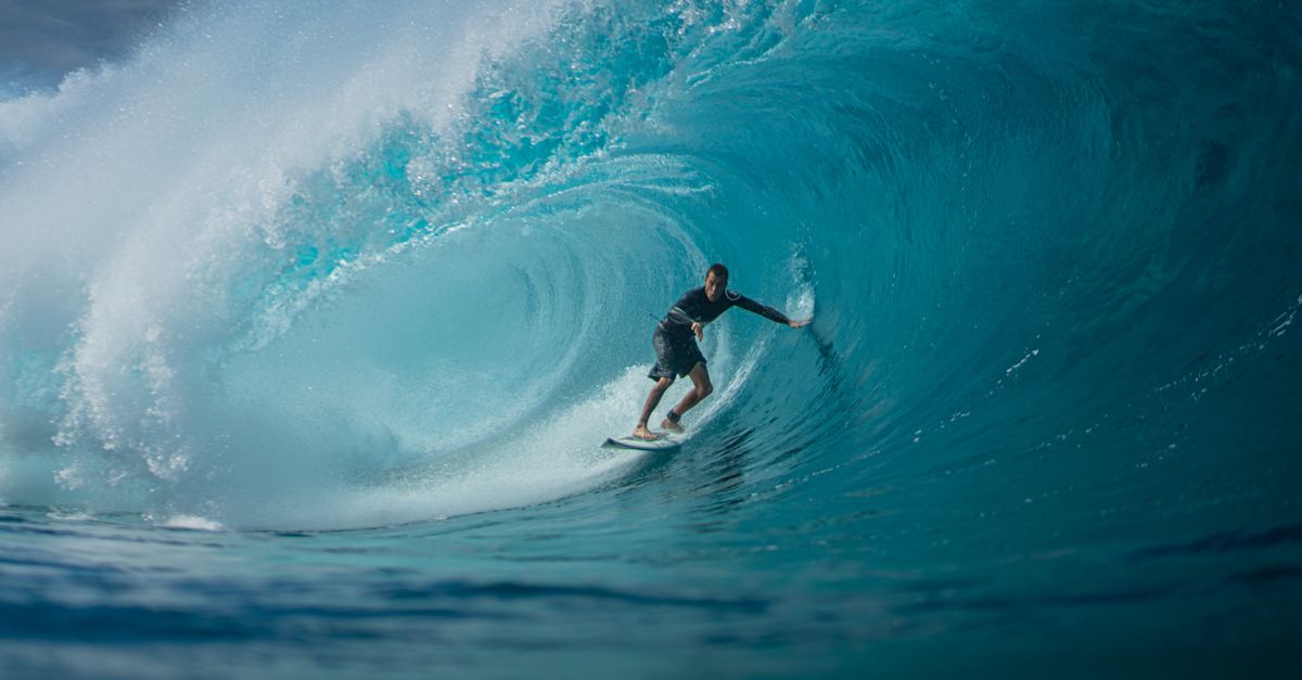 Surfer riding clean wave