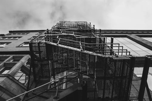 Clouds over Staircase on Building Wall