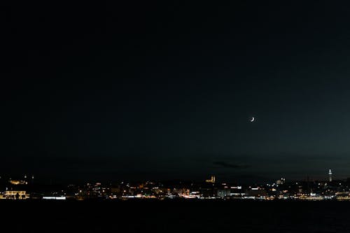 Crescent Moon over City