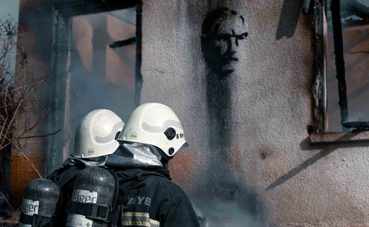 Firefighters putting out a house fire