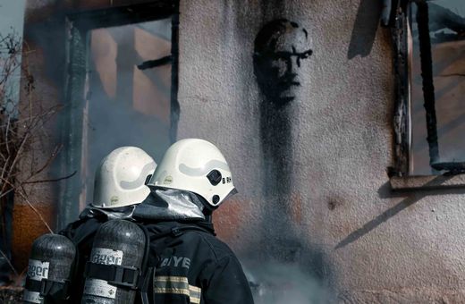 Firefighters putting out a house fire