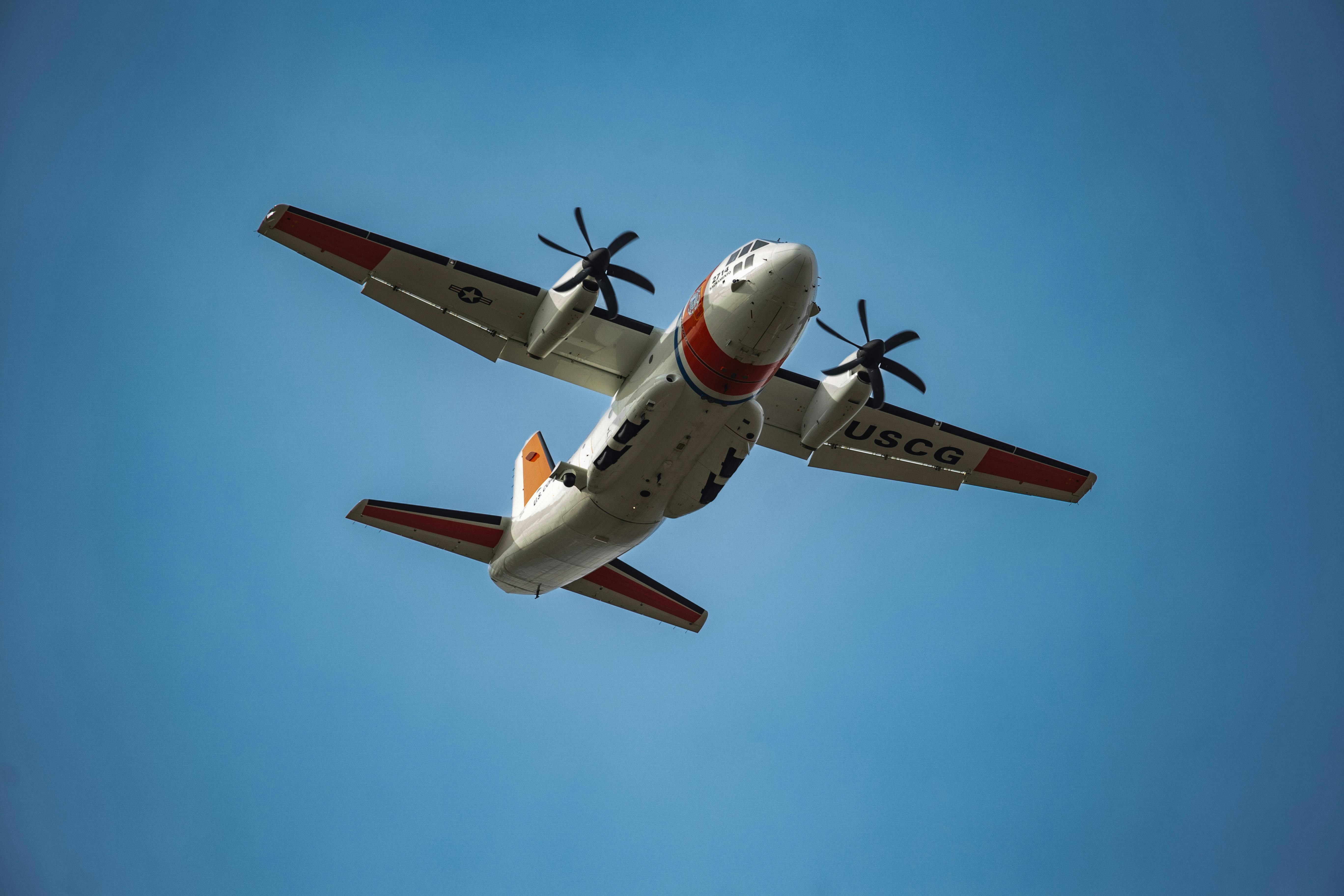 a military aircraft in the blue sky