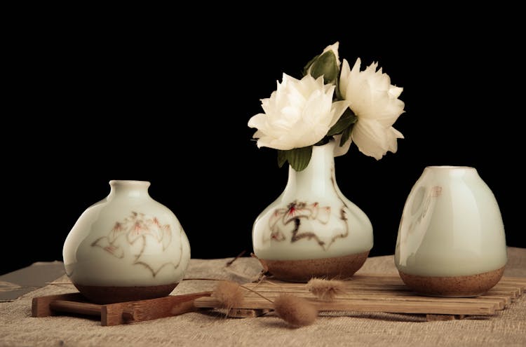 Photo Of White Lotus Flowers In A Vase