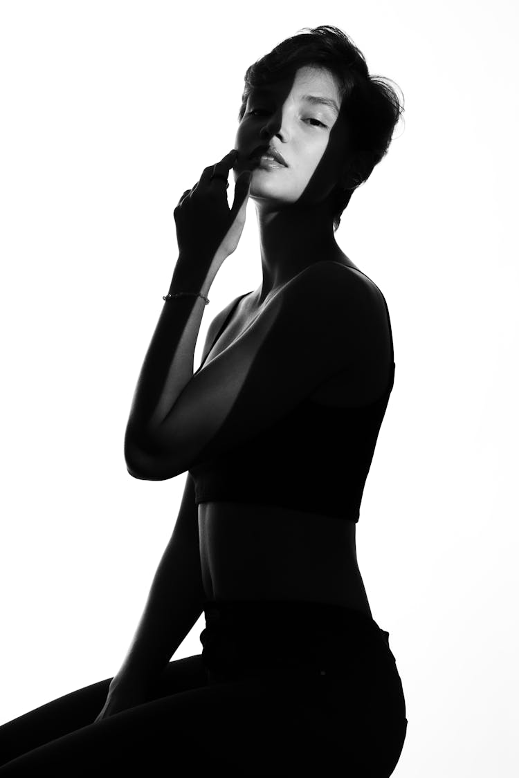 Silhouette Of Woman Posing On White Background