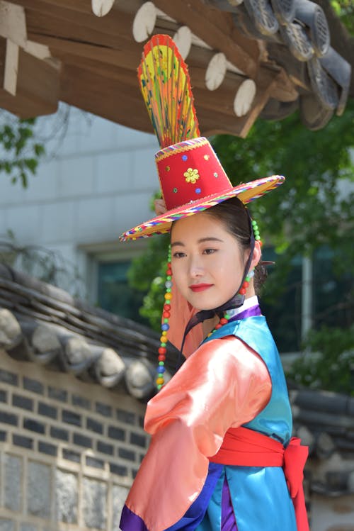 Woman Posing in Traditional, Colorful Clothes