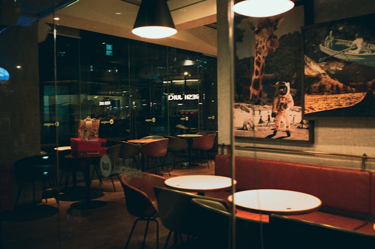 Empty Chairs And Tables On A Cafe