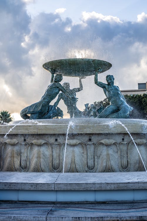 Fountain under White Clouds