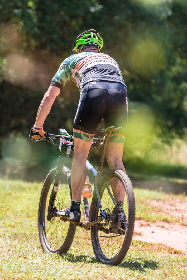Cyclist riding on a sunny outdoor trail