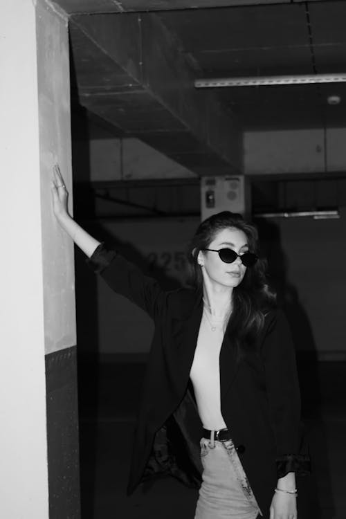 Grayscale Photo of Woman Wearing Sunglasses