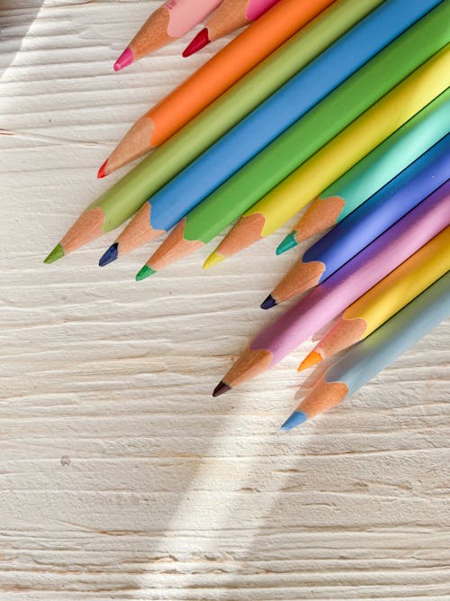 Close-up of Colored Pencils on a White Board 