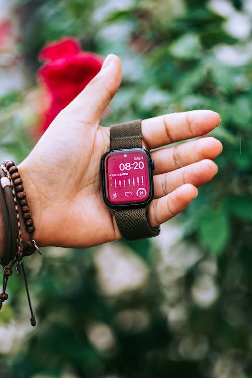 Hand Holding a Smartwatch 