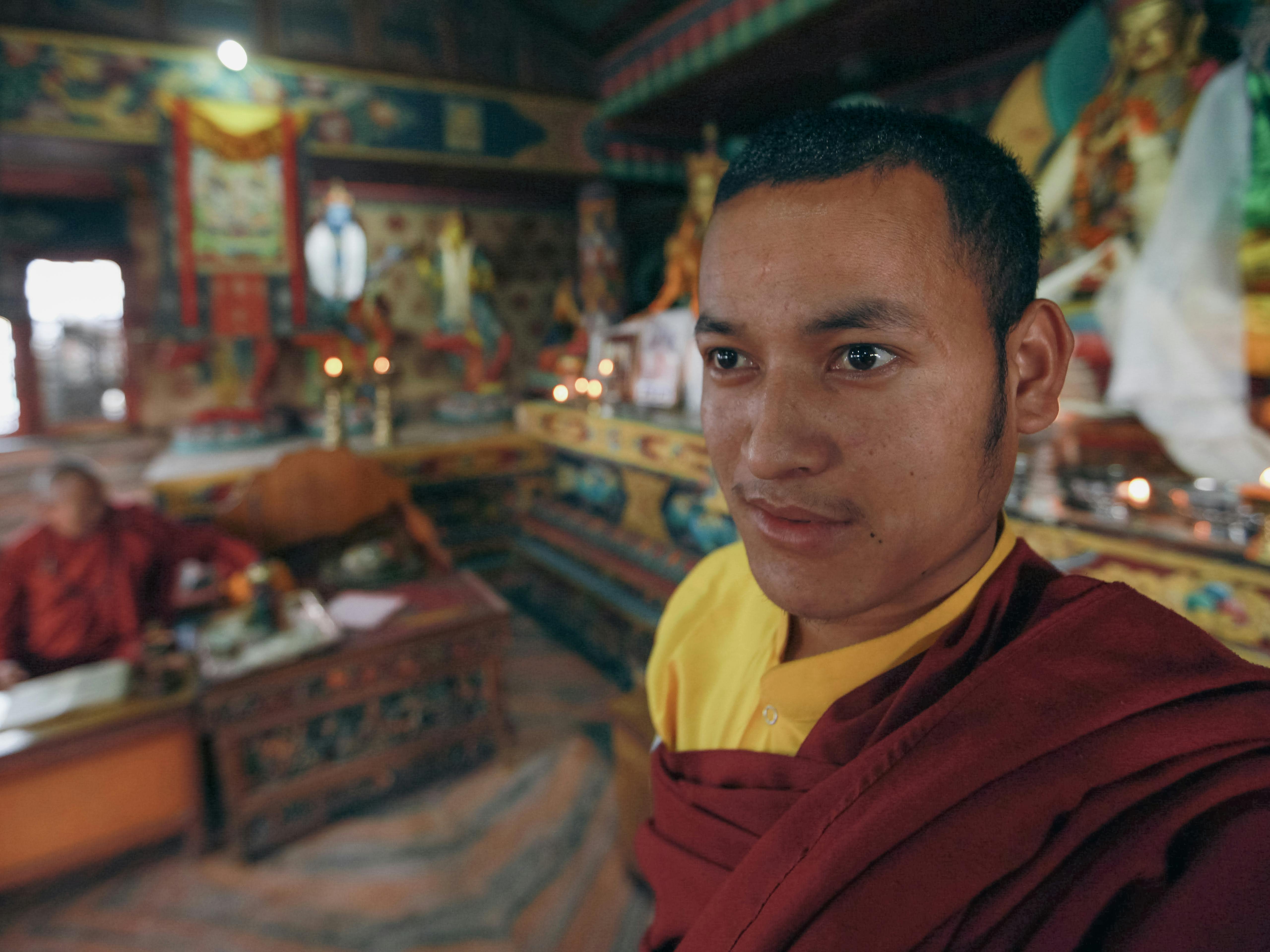 young-man-in-traditional-clothes-in-ornate-temple-free-stock-photo