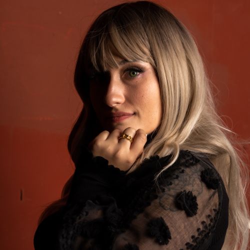 Woman with dramatic blonde waves