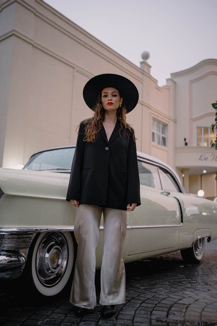 Woman Posing By Vintage Car