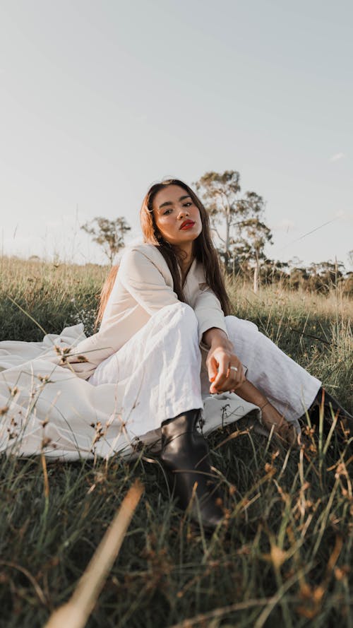 Woman Sitting on a Meadow