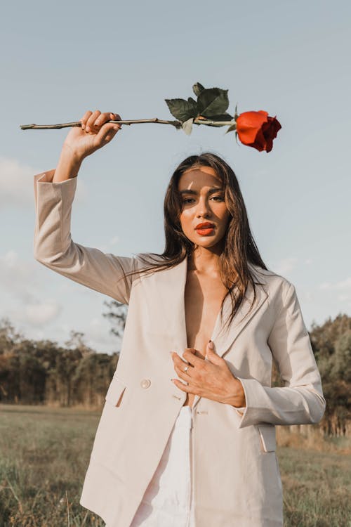 Portrait of Woman in Suit with Flower