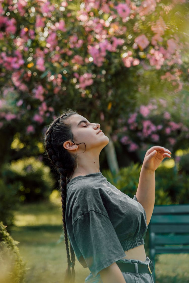 A Woman Relaxing In The Garden Park