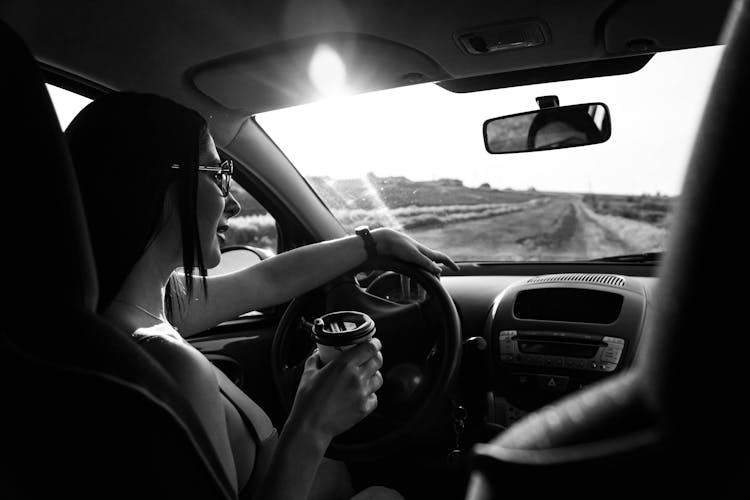 Smiling Woman Driving A Car