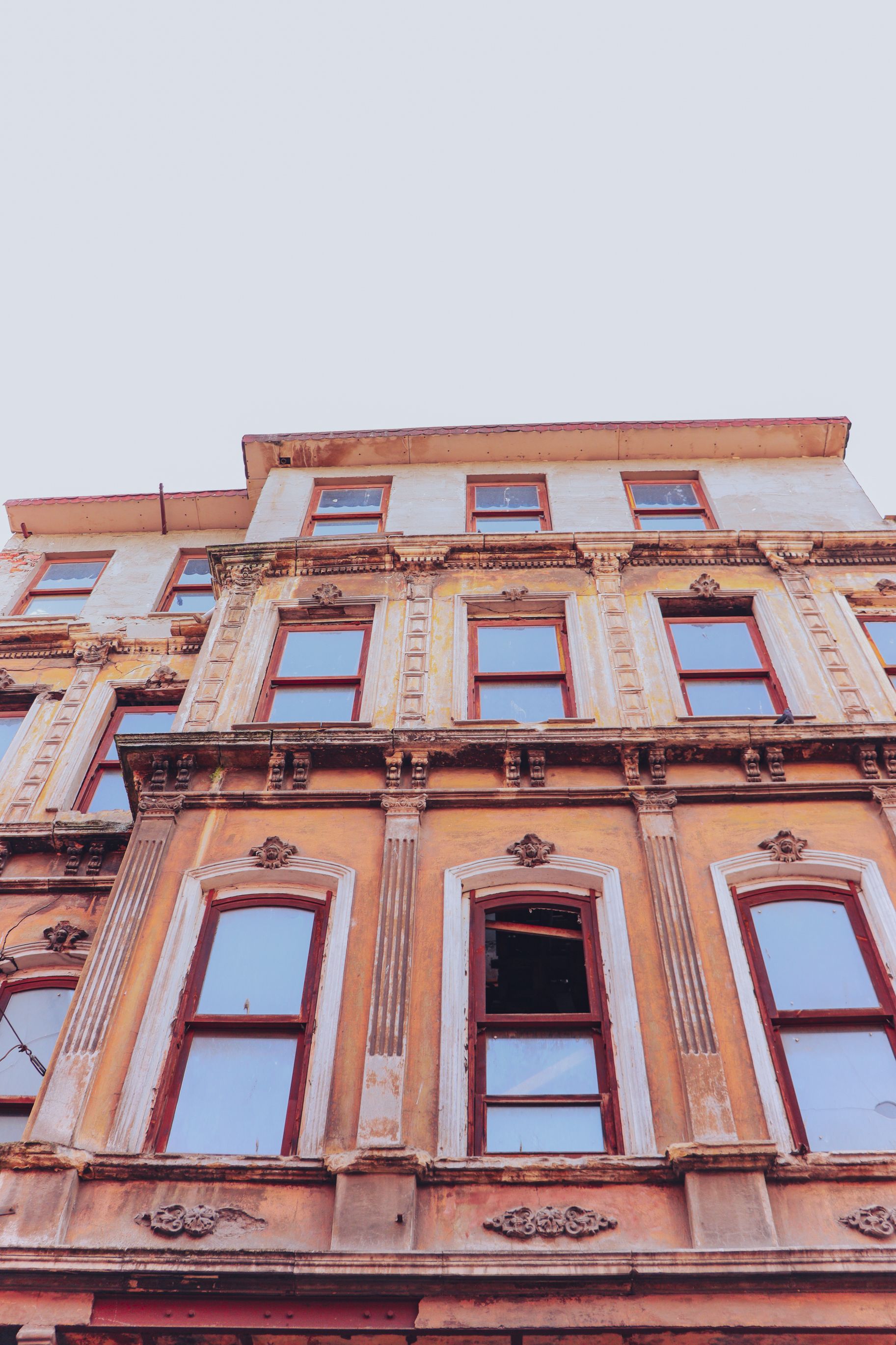 Low Angle Shot of a Brown Concrete Building · Free Stock Photo
