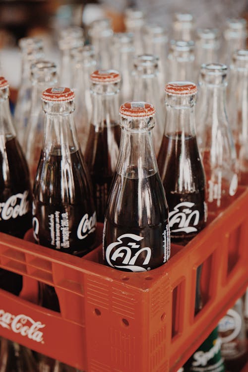Three White and Brass Coca-cola Bottles · Free Stock Photo