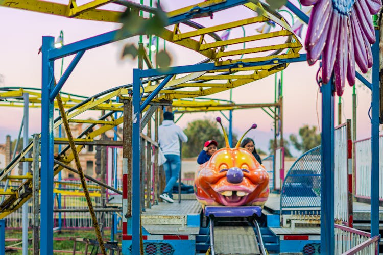 Children On Roller Coast At Amusement Park