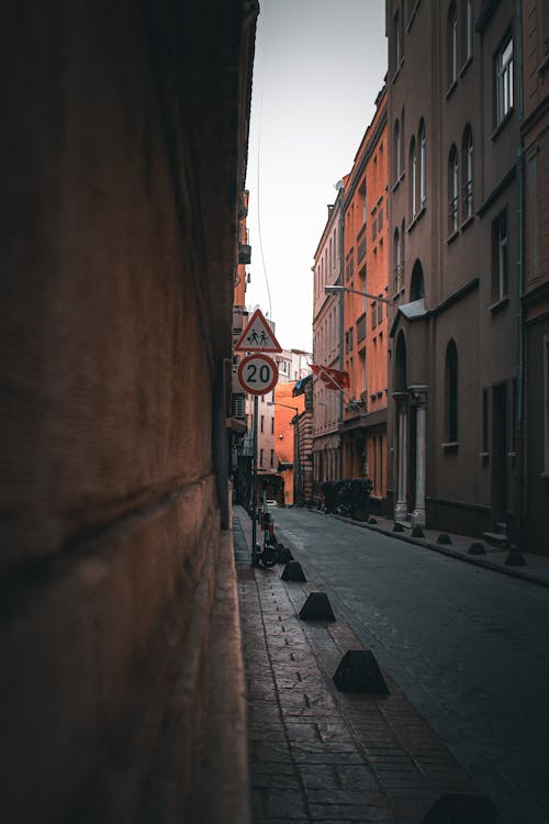 Narrow Street between Concrete Buildings