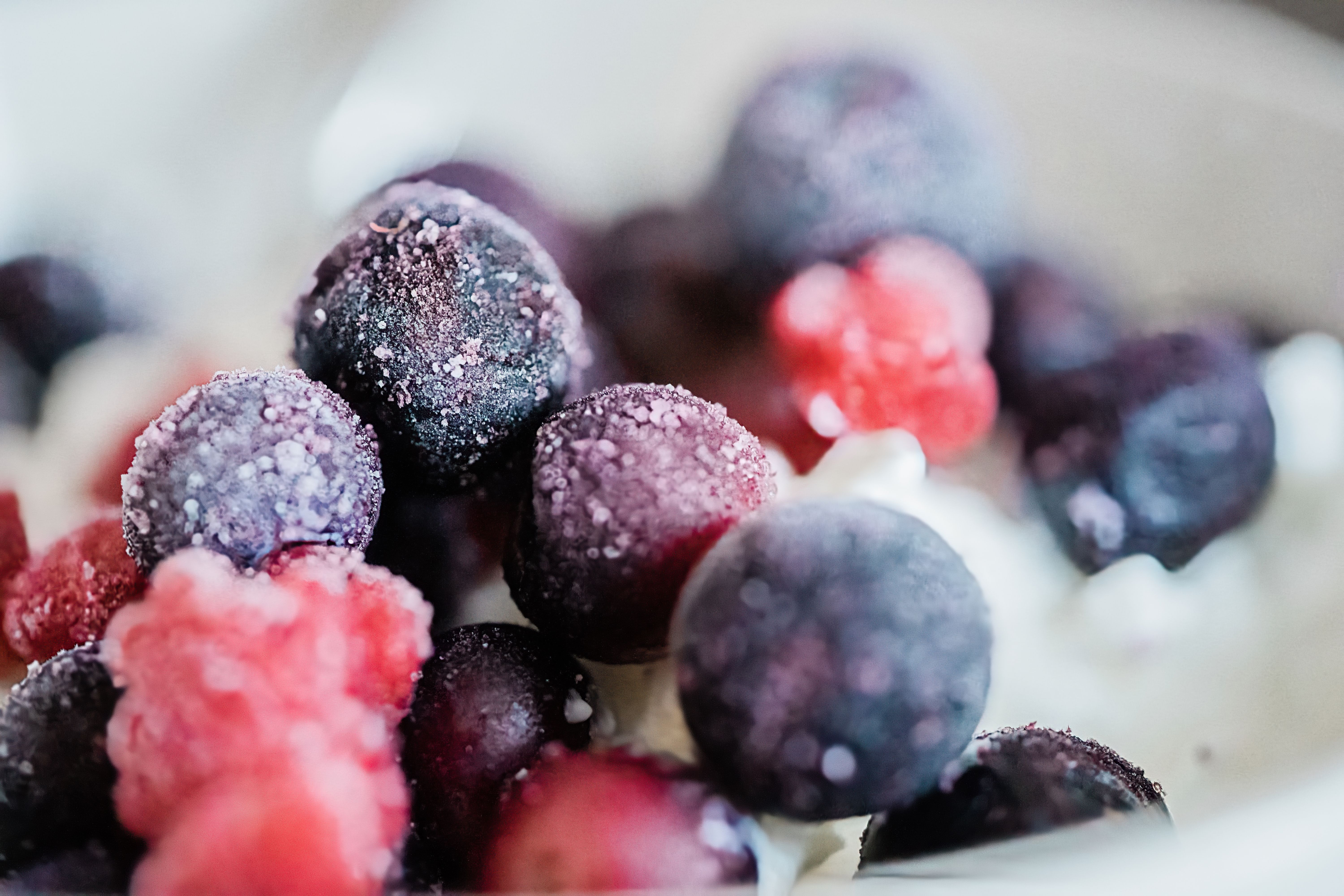 Vacuum sealer being used to store frozen berries