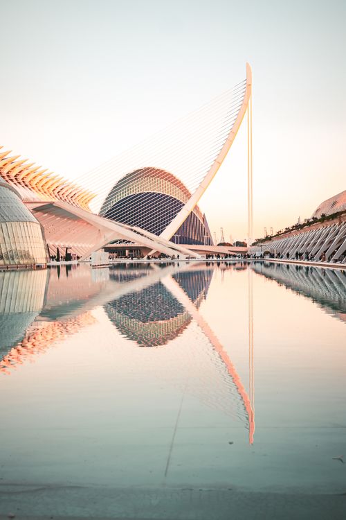 Free Stunning reflection of futuristic architecture at sunset in Valencia's City of Arts and Sciences. Stock Photo