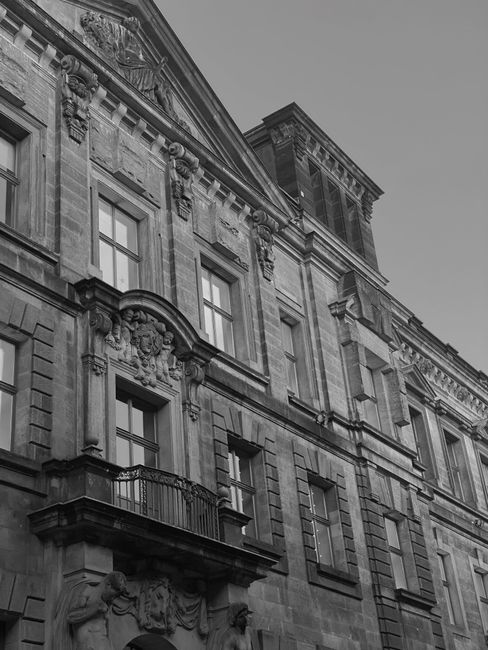 Black and white photo of vintage architecture in Dresden, Germany displaying ornate details and classic charm.