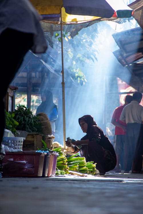 Woman Selling Vegetables in the Market