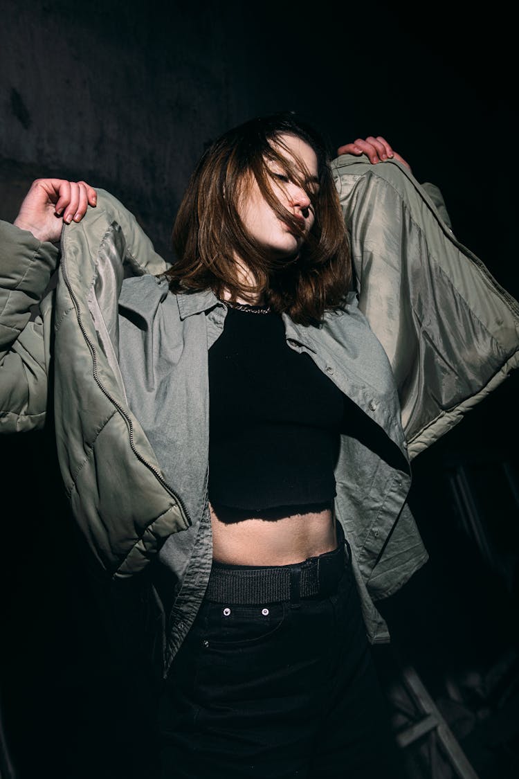 Girl In Casual Clothes Posing On Black Background