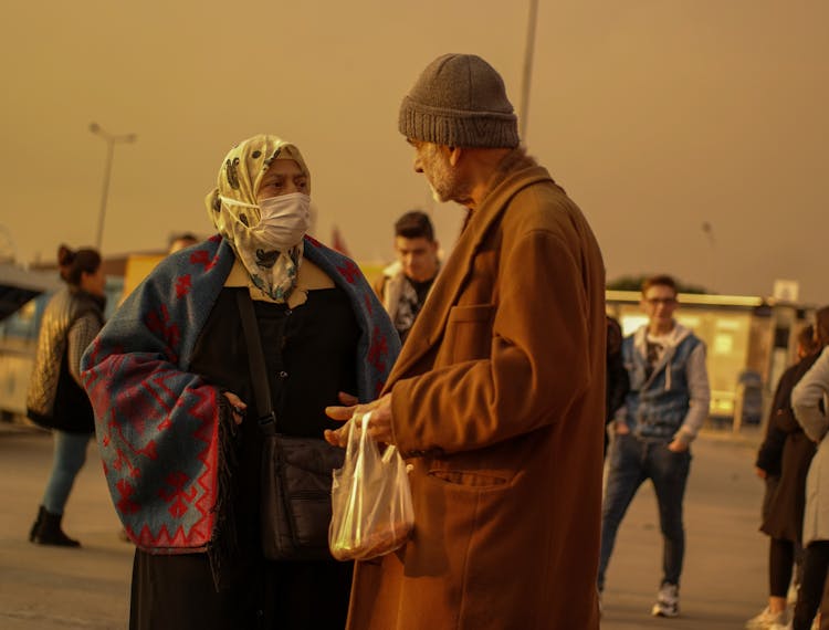 People Talking At Dusk 