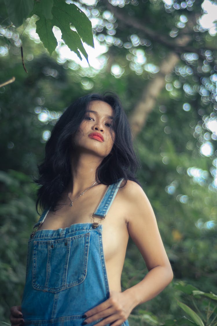 Portrait Of Woman In Jean Overalls