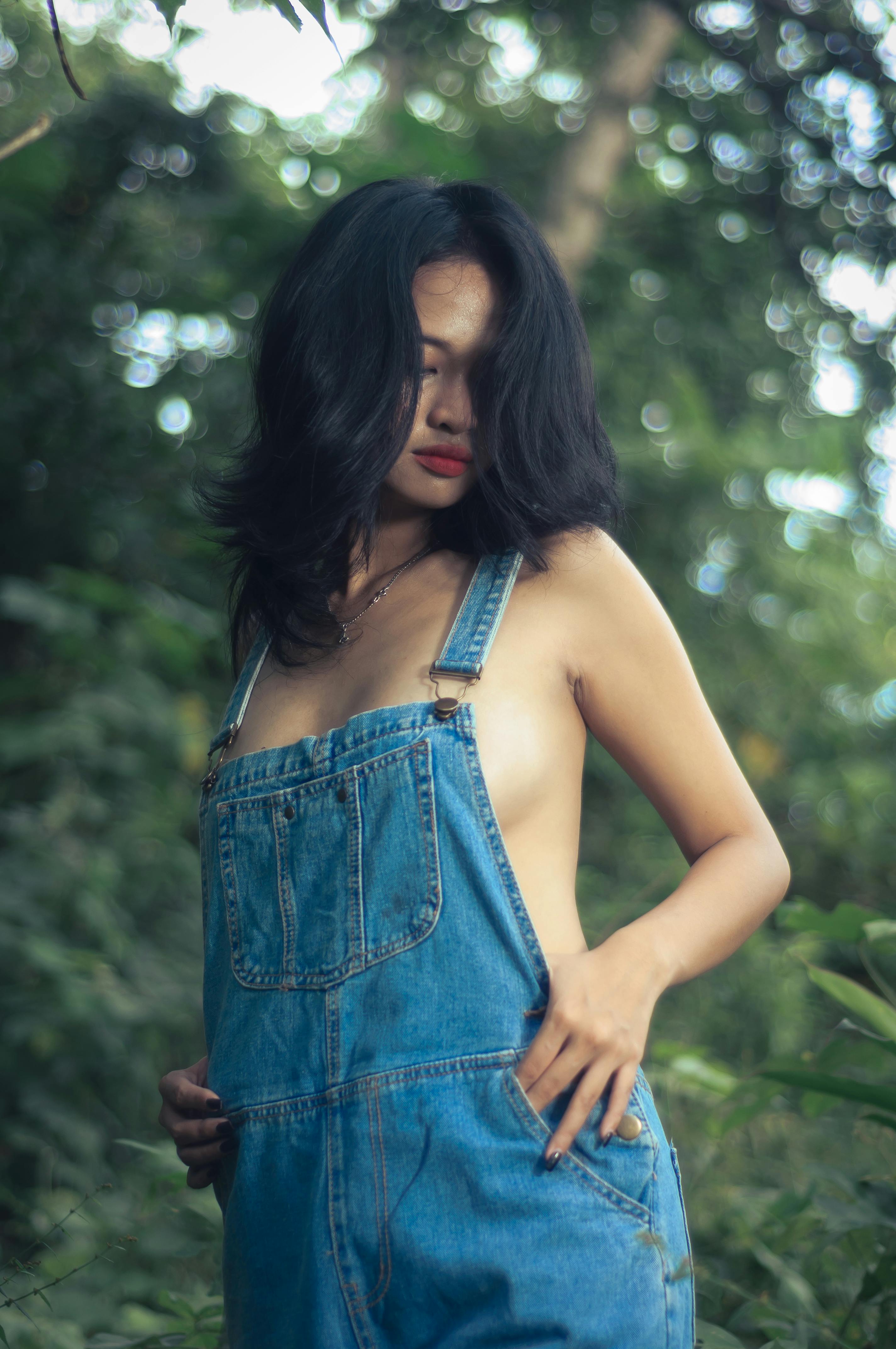 Young Woman Wearing Demin Overalls And A Sexy Tank Top Stock Photo, Picture  and Royalty Free Image. Image 63716086.