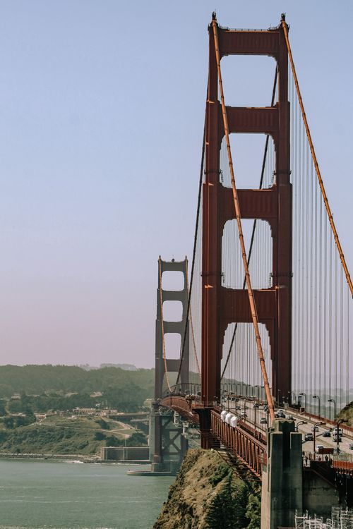 Free Vertical shot of the Golden Gate Bridge capturing its grandeur and engineering marvel. Stock Photo