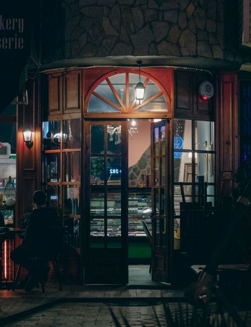 Free Inviting view of a warmly lit bakery entrance in Samsun, Turkey at night. Stock Photo