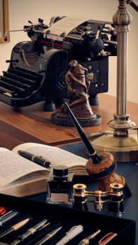 Elegant vintage desk with typewriter, ink, and quill pens in retro style.