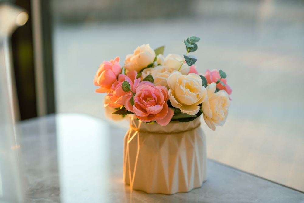 Artificial flowers arranged in a decorative vase