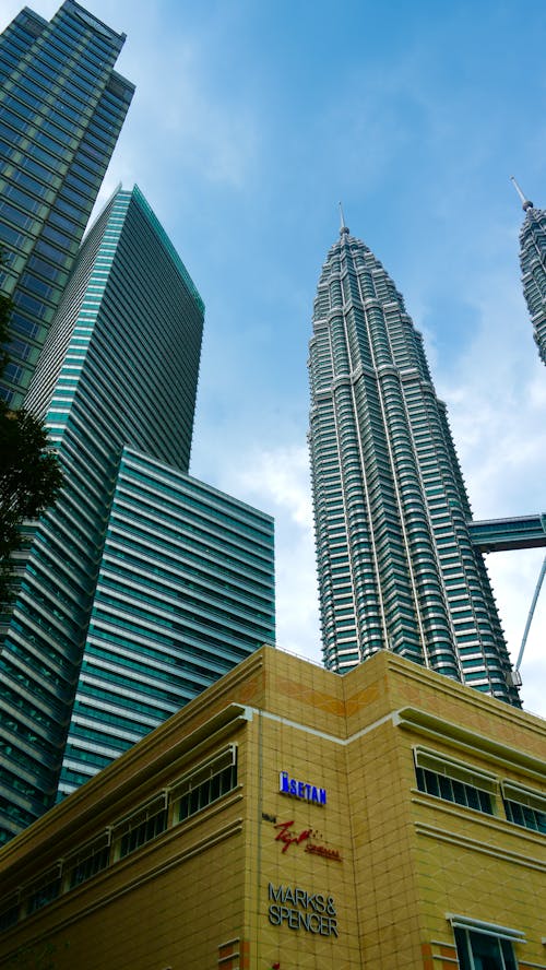 Low Angle Photo of City Buildings under Blue Sky