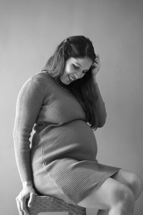Pregnant Woman Looking Down