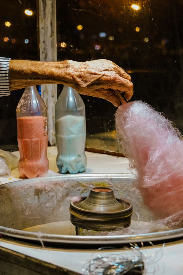 Candy floss machine spinning colourful candy floss