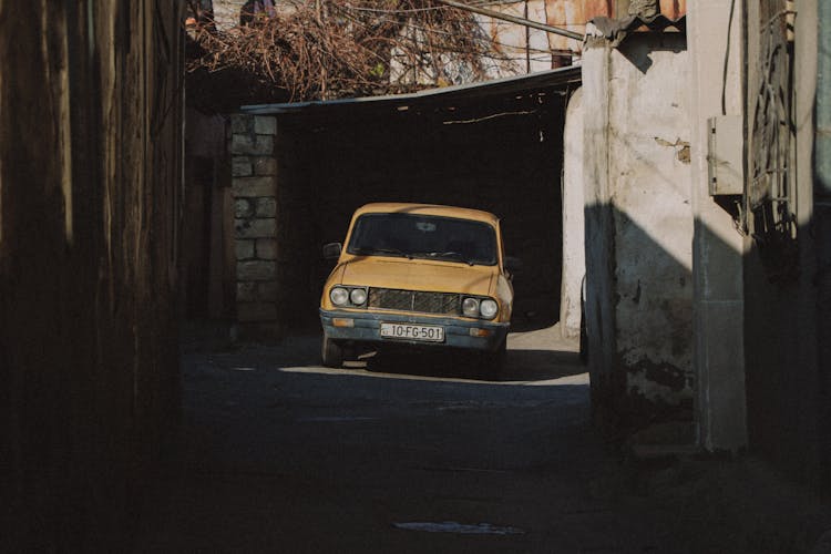 Old Car In Front Of Garage