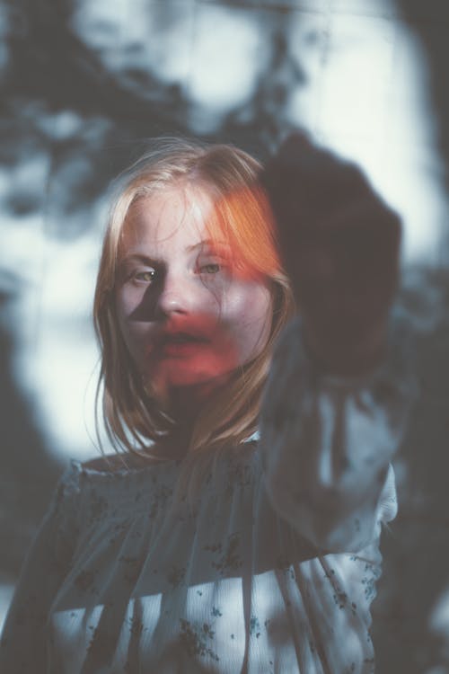 Photo of a Girl with Shadows on her face 