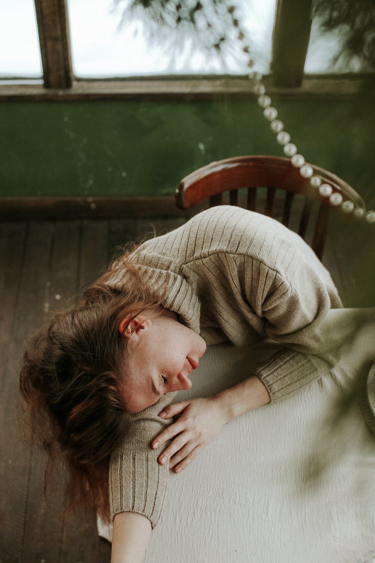 Woman Lying On A Table 